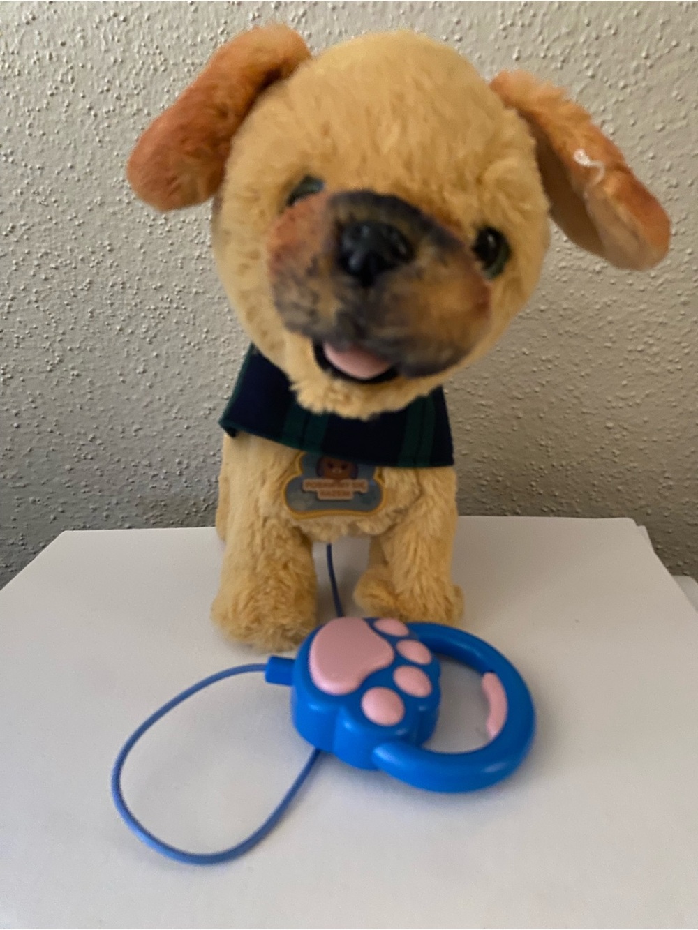 Source Unknown Tan Plush Puppy with Blue and Pink Paw Remote